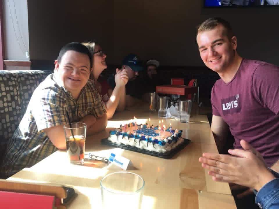Tyler celebrating a birthday with friends