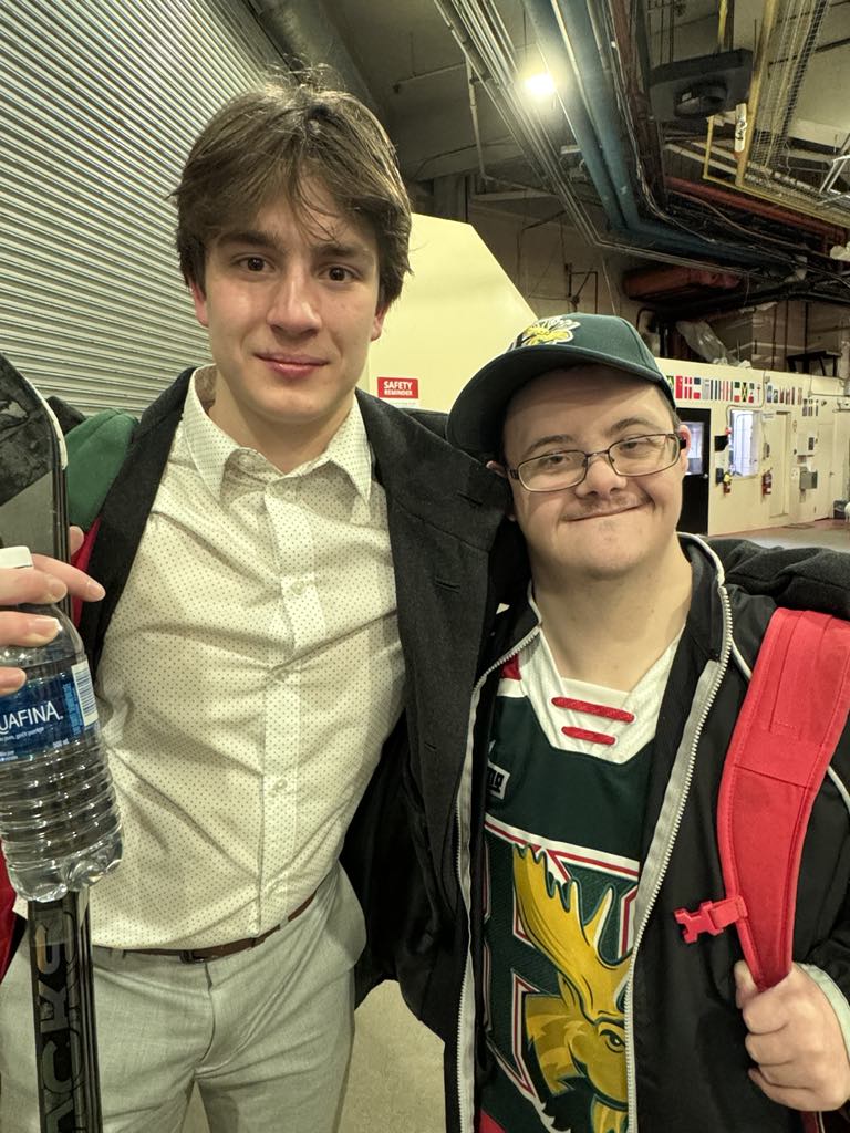 Tyler with a Mooseheads player